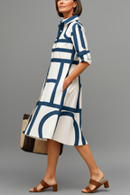 Vestido midi blanco azul - pose lateral caminando