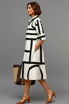Vestido midi blanco negro - pose lateral caminando