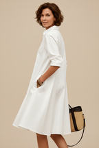 Vestido midi blanco - de espaldas mirando al hombro