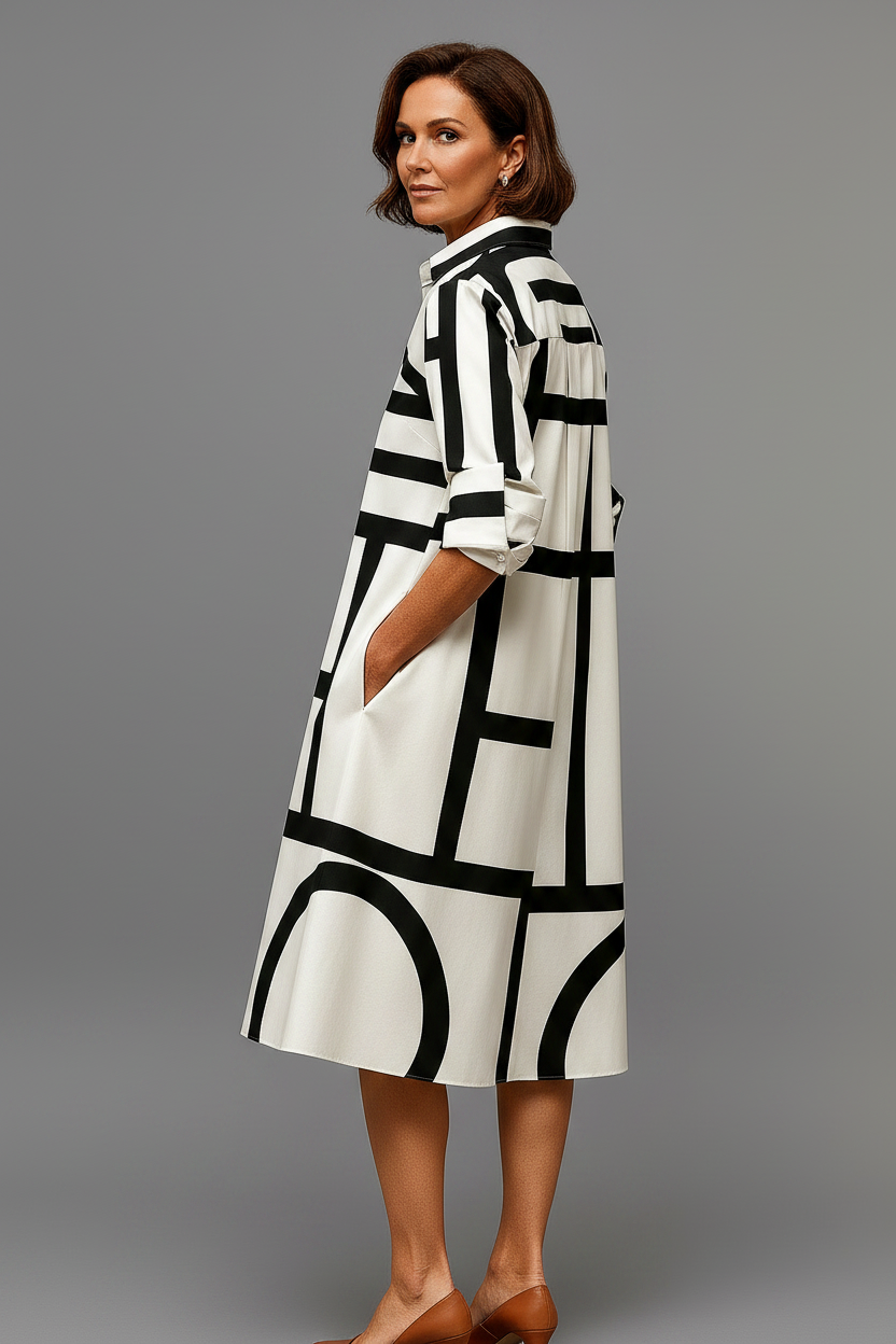 Vestido midi blanco negro - de espaldas mirando al hombro