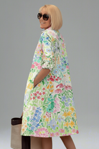 Vestido midi flores multicolores - de espaldas mirando al hombro